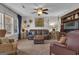 Cozy living room with comfortable leather seating and natural light, perfect for relaxing and entertaining at 11 Frances Turn, Sharpsburg, GA 30277