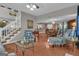 Spacious living area with hardwood floors, providing an open layout with staircase, and kitchen views at 11 Frances Turn, Sharpsburg, GA 30277