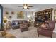 Cozy living room with comfortable leather seating and natural light, perfect for relaxing and entertaining at 11 Frances Turn, Sharpsburg, GA 30277