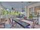 Inviting screened porch with an outdoor dining table and views of nature through the screened walls at 11 Frances Turn, Sharpsburg, GA 30277