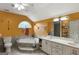 Bathroom featuring double vanity, large mirror, soaking tub and tiled floors at 5141 Dixie Lake Rd, Union City, GA 30291