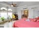 Bright bedroom featuring wood floors, ceiling fan and study nook near large windows offering plenty of natural light at 5141 Dixie Lake Rd, Union City, GA 30291