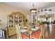 Dining room features a glass-top table with seating for six and vintage decor at 5141 Dixie Lake Rd, Union City, GA 30291