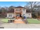 Spacious home featuring a private deck with outdoor seating and a landscaped yard at 5141 Dixie Lake Rd, Union City, GA 30291