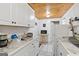 Efficient kitchen featuring ample countertop space, white cabinets, and modern appliances at 5141 Dixie Lake Rd, Union City, GA 30291