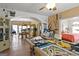 Open-concept living room with billiard table and access to the dining room and other living spaces at 5141 Dixie Lake Rd, Union City, GA 30291