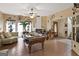 Bright and airy living room with a billiard table, fireplace, hardwood floors, and decorative accents at 5141 Dixie Lake Rd, Union City, GA 30291