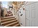 View of carpeted staircase with handrails and decorative items on the wall at 5141 Dixie Lake Rd, Union City, GA 30291
