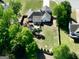 An aerial view of the backyard with a fenced yard and trees at 140 Pecan Ridge Dr, Fayetteville, GA 30215