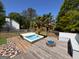 Backyard deck featuring a hot tub, fire pit, and privacy fencing at 140 Pecan Ridge Dr, Fayetteville, GA 30215