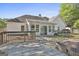 Charming home featuring a wooden deck, a hot tub, and a well-maintained backyard at 140 Pecan Ridge Dr, Fayetteville, GA 30215