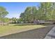 Sprawling backyard featuring a well-maintained lawn, privacy fence, and mature trees at 140 Pecan Ridge Dr, Fayetteville, GA 30215