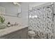 Elegant bathroom featuring a marble countertop vanity and a charming nautical-themed shower curtain at 140 Pecan Ridge Dr, Fayetteville, GA 30215