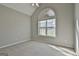 Bright bedroom with plush carpeting, a vaulted ceiling, and a large window offering plenty of natural light at 140 Pecan Ridge Dr, Fayetteville, GA 30215