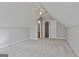 Attic bedroom with neutral walls, carpet flooring, and access to ensuite bathroom at 140 Pecan Ridge Dr, Fayetteville, GA 30215