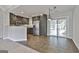 Modern kitchen with granite countertops, stainless steel appliances, and adjacent sunroom with sliding glass doors at 140 Pecan Ridge Dr, Fayetteville, GA 30215