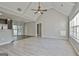 Bright living room features vaulted ceilings and a ceiling fan, complemented by light gray walls and light wood-look floors at 140 Pecan Ridge Dr, Fayetteville, GA 30215