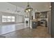 Spacious living room with fireplace, ceiling fan, and views into the kitchen with stainless appliances at 140 Pecan Ridge Dr, Fayetteville, GA 30215