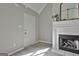 Cozy living room featuring a fireplace, vaulted ceilings, and modern flooring at 140 Pecan Ridge Dr, Fayetteville, GA 30215