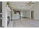 Open floor plan featuring living room with fireplace and kitchen with stainless steel appliances at 140 Pecan Ridge Dr, Fayetteville, GA 30215