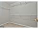 Empty walk-in closet with carpeted floors and built-in shelving at 140 Pecan Ridge Dr, Fayetteville, GA 30215