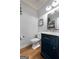 Stylish half bathroom with elegant vanity, modern fixtures, and tasteful decor for guests' convenience at 102 Santolina Park, Peachtree City, GA 30269