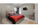 Bedroom featuring a gray bed frame, TV, and Georgia Bulldogs-themed decorations at 102 Santolina Park, Peachtree City, GA 30269