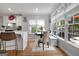 Cozy breakfast nook with natural light, built-in seating, and views of the surrounding greenery at 102 Santolina Park, Peachtree City, GA 30269
