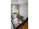 Grand two-story foyer with hardwood floors, iron staircase, large window, and elegant light fixture at 102 Santolina Park, Peachtree City, GA 30269