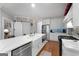 Modern kitchen with stainless steel appliances, a large island with seating, and an open concept layout at 102 Santolina Park, Peachtree City, GA 30269