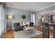 Inviting living room with hardwood floors, decorative accents, and soft natural light at 102 Santolina Park, Peachtree City, GA 30269
