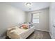 Cozy bedroom with carpet, a single window, and neutral walls at 195 Riverbend Dr, Covington, GA 30014