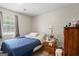 Simple bedroom featuring carpeted floor and a window at 195 Riverbend Dr, Covington, GA 30014