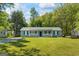 Charming single-story home with a well-maintained lawn and inviting front porch at 195 Riverbend Dr, Covington, GA 30014