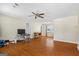 Spacious living room with hardwood floors, a ceiling fan, and plenty of natural light at 195 Riverbend Dr, Covington, GA 30014