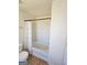 Full bathtub with white tile, shower, and toilet in clean bathroom at 6806 Blackstone Pl # 12, Mableton, GA 30126
