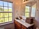 Bathroom featuring vanity with wood cabinets, sink, mirror and window at 6806 Blackstone Pl # 12, Mableton, GA 30126