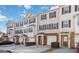 Charming townhomes featuring a brick and siding facade, individual garages, and well-maintained landscaping at 6806 Blackstone Pl # 12, Mableton, GA 30126