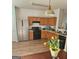 Kitchen featuring stainless steel refrigerator and wooden cabinets at 6806 Blackstone Pl # 12, Mableton, GA 30126