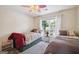 Bedroom featuring two twin beds, a window with sheer curtains, and a neutral color scheme at 750 Gates Ln, Alpharetta, GA 30022