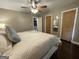 Cozy bedroom with neutral walls, ceiling fan, and paneled doors at 727 Channing Dr, Atlanta, GA 30318