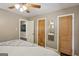 Bedroom showcasing original paneled doors and a cozy bed at 727 Channing Dr, Atlanta, GA 30318