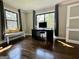 Bright bedroom with hardwood floors, bench seating, and work from home setup at 727 Channing Dr, Atlanta, GA 30318