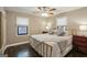 Bedroom featuring a gold-colored bed frame, neutral tones, and natural light from two windows at 727 Channing Dr, Atlanta, GA 30318