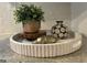 Interior decor arrangement with plant, vases, and a golden figurine on a decorative circular tray at 727 Channing Dr, Atlanta, GA 30318