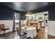 Cozy dining room featuring a table set for dining and a view into the updated kitchen at 727 Channing Dr, Atlanta, GA 30318