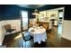 Bright dining room with views to kitchen features a table with seating for four at 727 Channing Dr, Atlanta, GA 30318