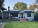 Inviting home showcasing brick steps, stone and gray shingle accents, and modern solar panels at 727 Channing Dr, Atlanta, GA 30318