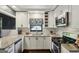 Updated kitchen features white cabinets, stainless steel appliances, and stone countertops at 727 Channing Dr, Atlanta, GA 30318