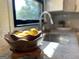 Close up view of a granite countertop and a stainless steel faucet in a bright kitchen at 727 Channing Dr, Atlanta, GA 30318
